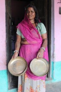 A woman showing the box which had all her jewellery-now empty